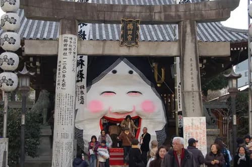 Large Otafuku masks welcome you to Kushida Shrine, Fukuoka