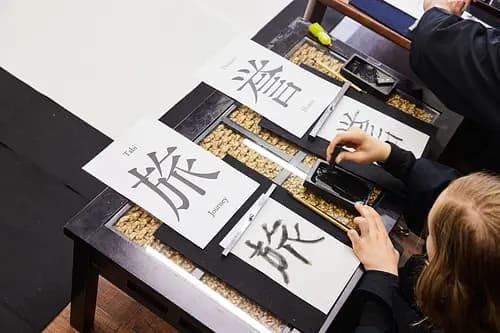 Learning Japanese Zen Calligraphy in Kimono by Osaka Castle