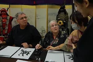 Learning Japanese Zen Calligraphy in Kimono by Osaka Castle