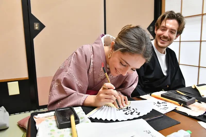 Learning Japanese Zen Calligraphy in Kimono by Osaka Castle