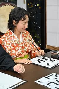 Learning Japanese Zen Calligraphy in Kimono by Osaka Castle