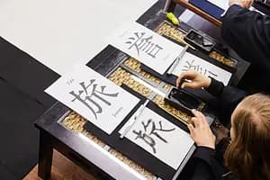 Learning Japanese Zen Calligraphy in Kimono by Osaka Castle