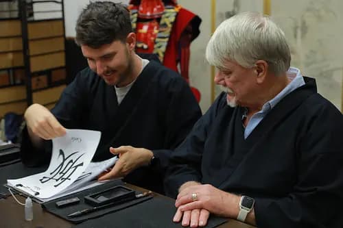 Learning Japanese Zen Calligraphy in Kimono by Osaka Castle