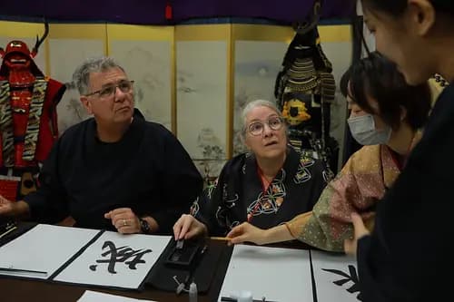 Learning Japanese Zen Calligraphy in Kimono by Osaka Castle